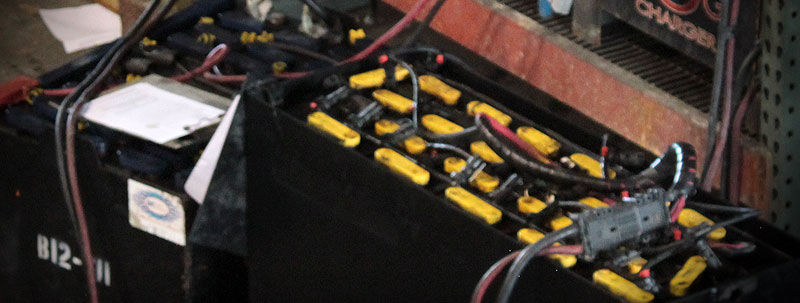 Rental batteries charging in the shop.