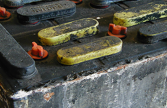 Damage to a forklift battery from overwatering.
